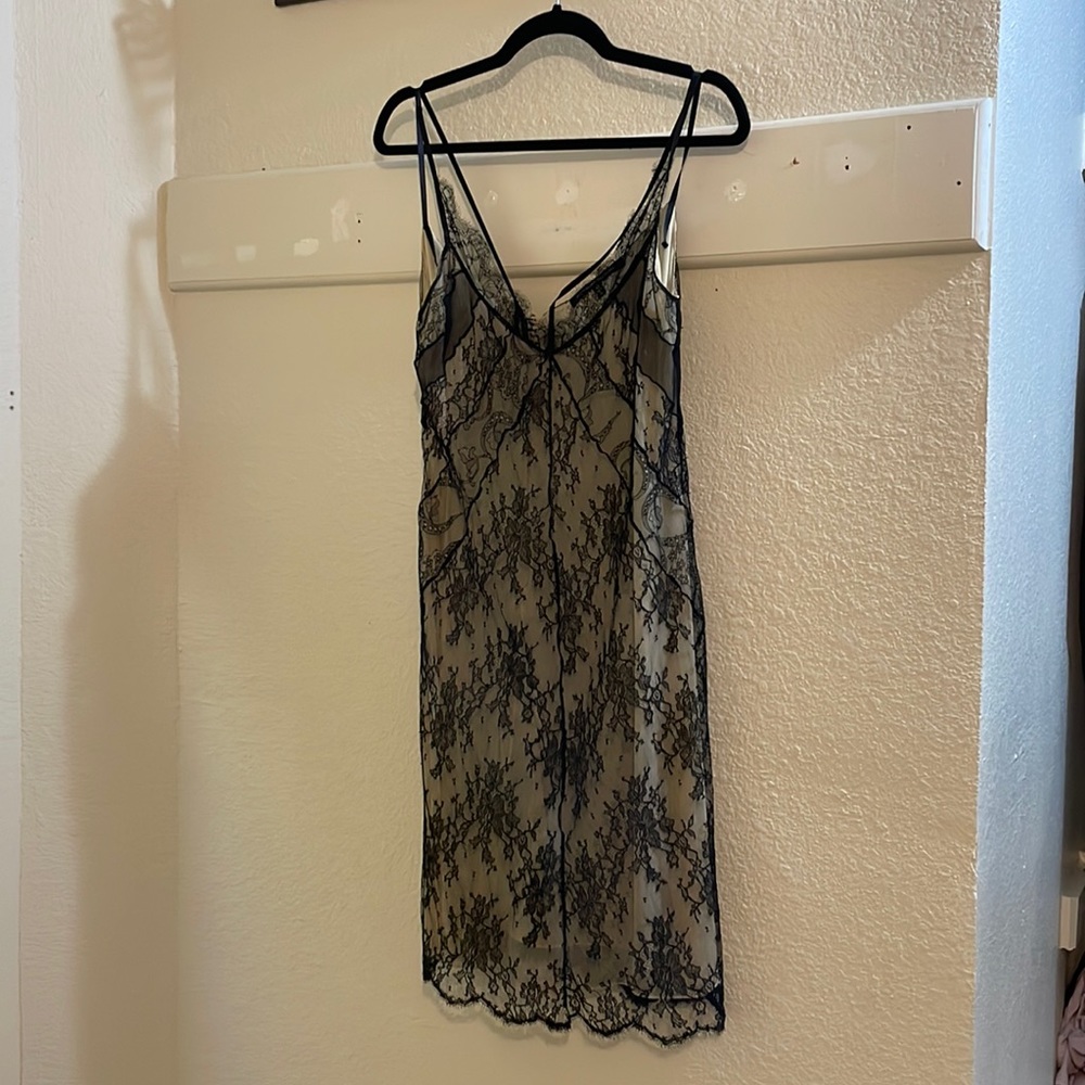 Beautiful lace dress with sexy black button details in the back